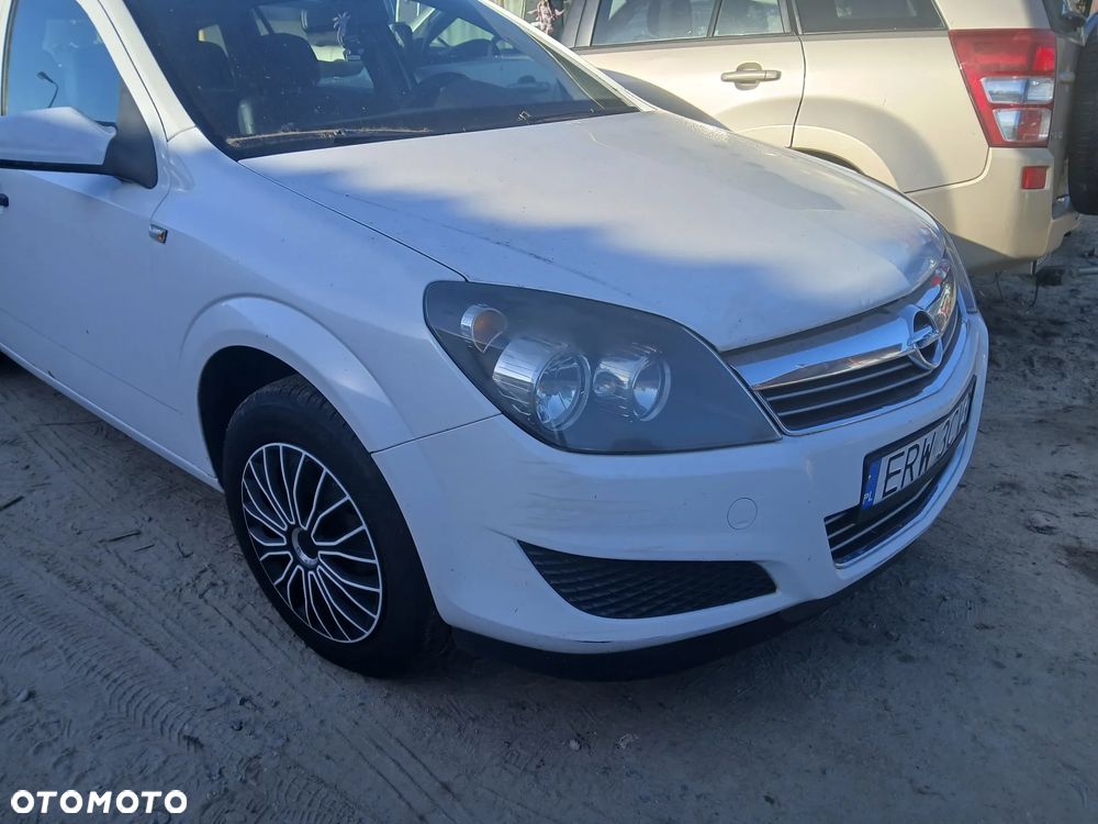 Astra H Kombi z40r maska pokrywa silnika klapa bagażnika zderzak lampa reflektor pas przedni stop lampy halogeny przeciwmgłowe odblaski grill atrapa znaczek błotnik błotniki drzwi - 1