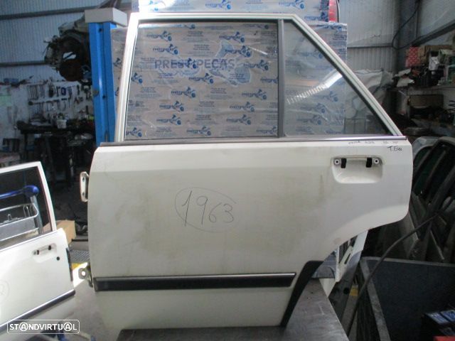 Porta POR1963 MAZDA 323 1986 4P BEGE TE - 1