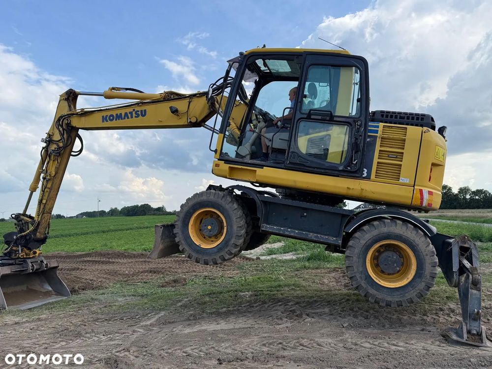 Komatsu Koparka kołowa Komatsu PW 148 Pług podpory Klima Centralne smarowanie Rototil Ramię 2 razy łamane PIĘKNA - 36