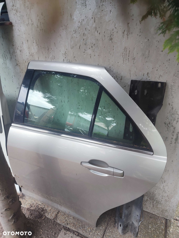 Cadillac STS lewe tylne drzwi