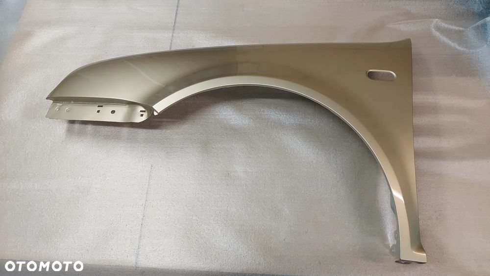 VW GOLF IV 97-06 rok błotnik lewy lub prawy przedni LA1W cynk.