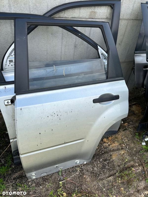 Nissan X-Trail T31 KOMPLETNE DRZWI LEWE TYLNE KY0