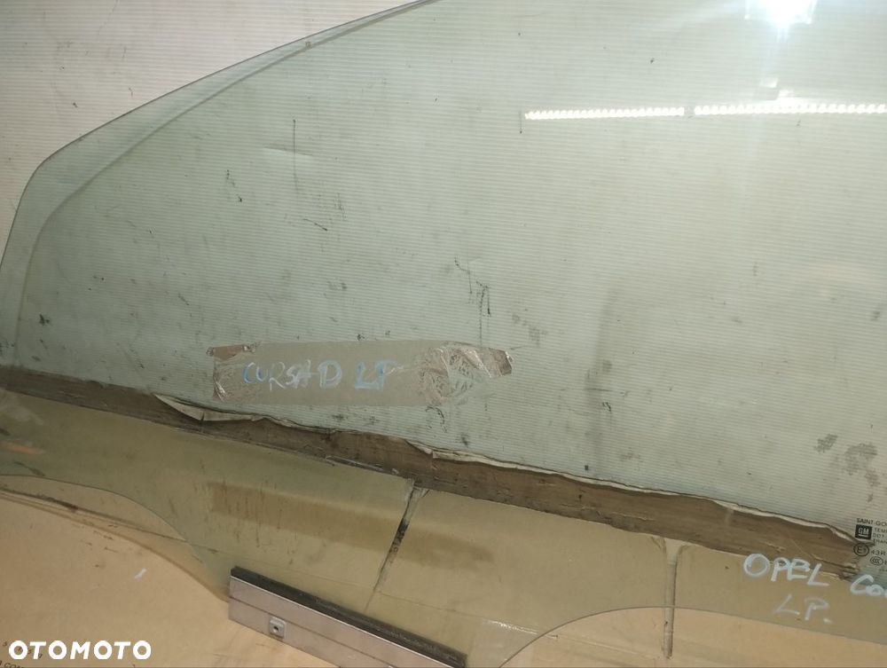 SZYBA BOCZNA LEWA PRZEDNIA DRZWI OPEL CORSA D 1.0 - 2
