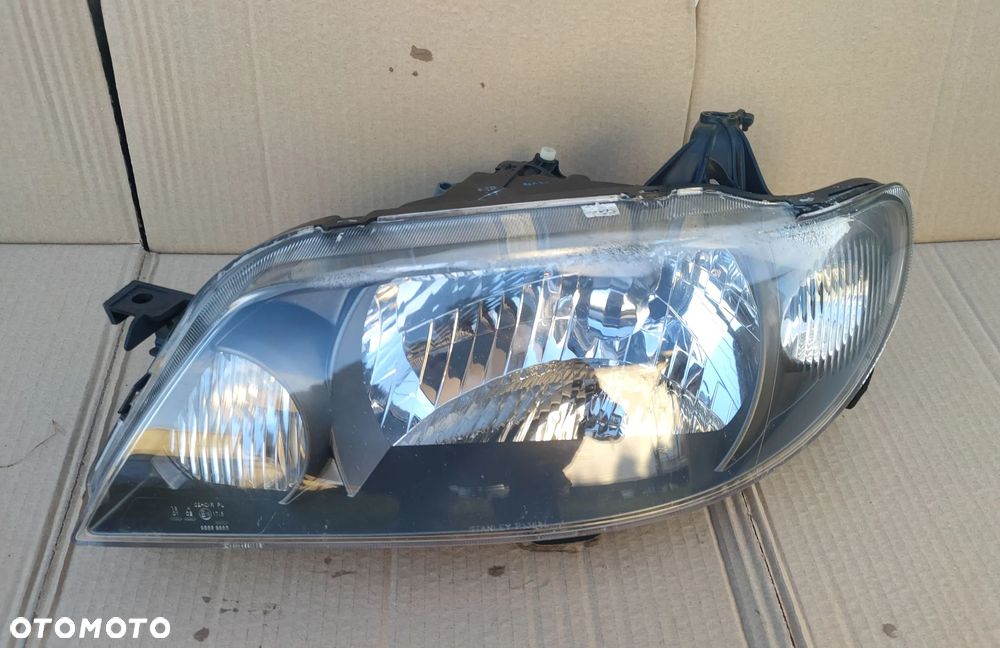 Reflektor lewy Lampa lewa Mazda 323F 2001- Czarna EU