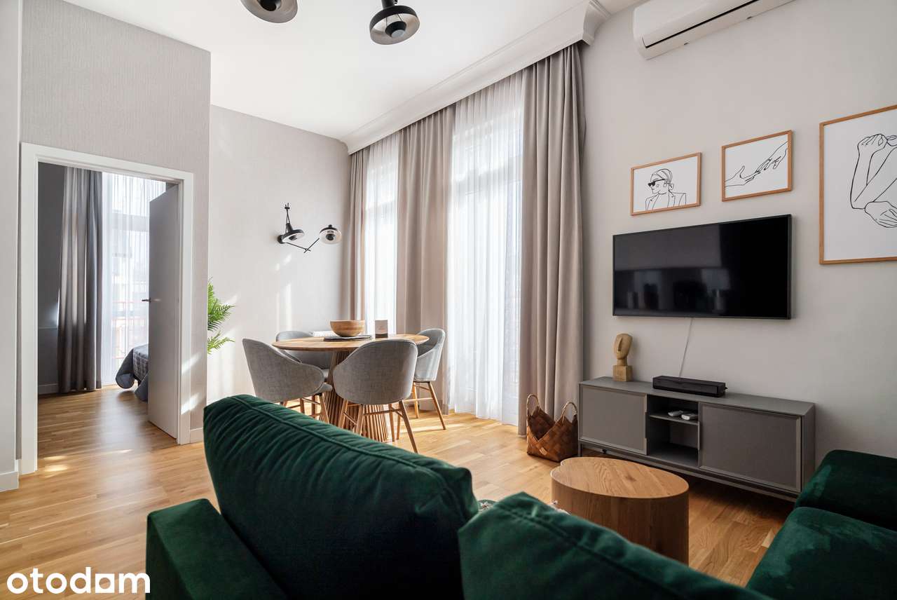 Dwupokojowy apartament przy promenadzie z bocznym widokiem na morze