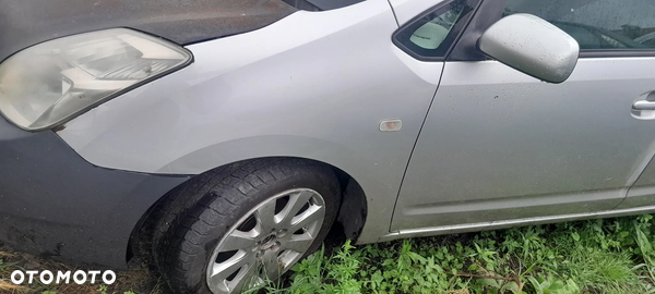 TOYOTA PRIUS II 03-09 BŁOTNIK LEWY PRZÓD 1C0