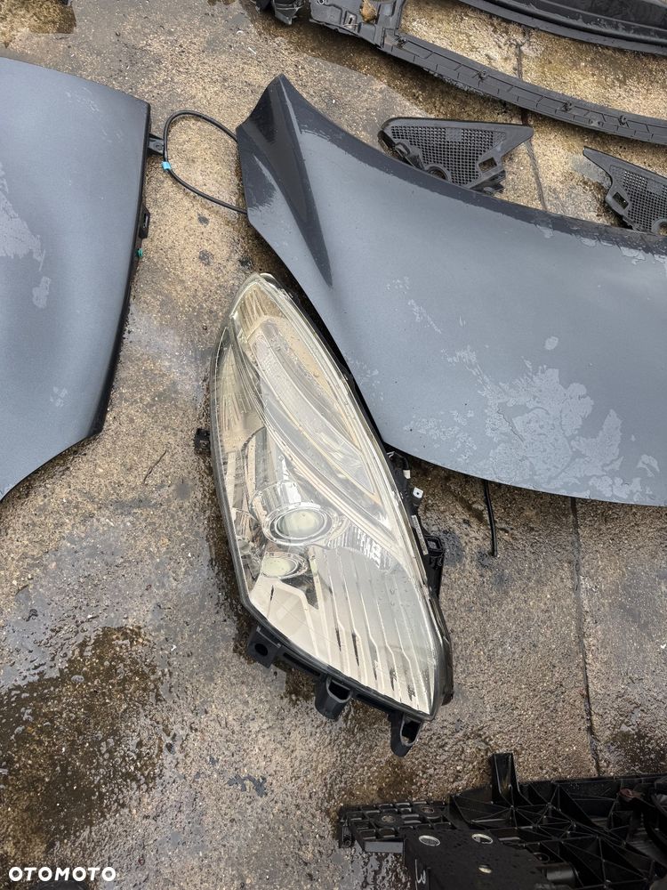 Renault grand scenic 3  grandscenic TEB66  / EA3 / Jz1V / TLALLE / SZHR / SAN513 // D22240 drzwi prawe lewe przednie tylne tył przód kompletny przód grand Scenic 3 szary ciemny drzwi prawe lewe lusterko składane zderzak tył tylni klapa bagażnika klapa tył lampy tył tylnie prawa lewa belka tylnia Podszybie kompletne osłoną słupka prawa lewa zawiasy maski prawy lewy wąż węże klimy podstawa akumulatora zbiorniczek spryskiwaczy filtr powietrza belka dolna przednia na dole zbiorniczek płynu chłodzącego  Lampa prawa lewa bixenon xenon 08120 /260100027r / 89902929  błotnik przód przedni prawy lewy maska pas przedni benzyna tce 130 benzyna zderzak przód przedni pdc 4 czujniki spryski Zenona komplet - 5