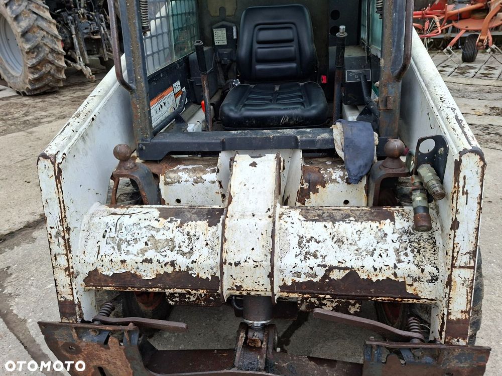 Bobcat 553 4X4 + Melroe Ingersoll-Rand 725S B/H - 11