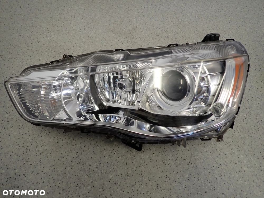 MITSUBISHI OUTLANDER II 10-12 REFLEKTOR LAMPA PRZEDNIA LEWA XENON EUROPA - 1
