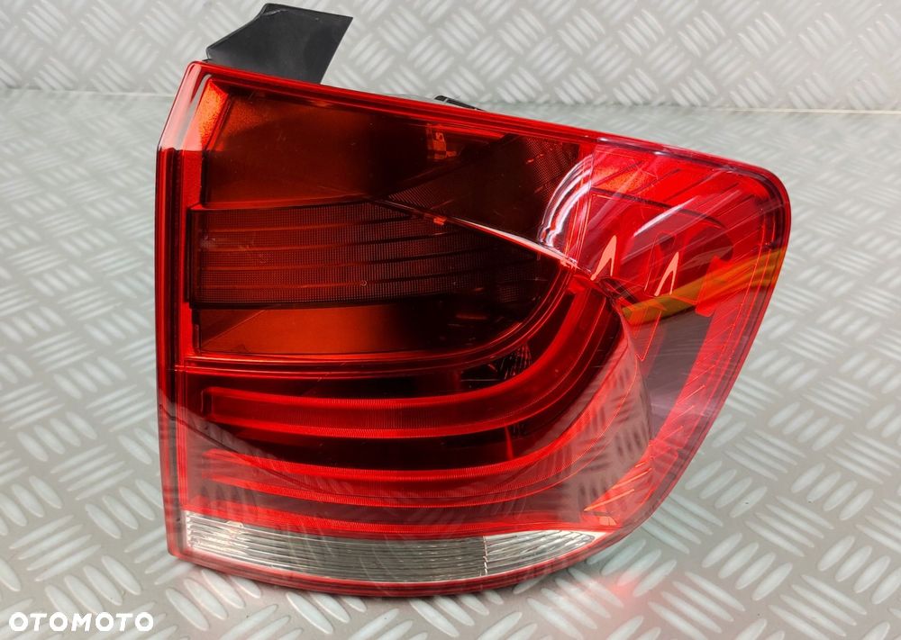 03.424.50 lampa prawa prawy tył tylna w błotnik BMW X1 E84 2009-2015 EUROPA - 1