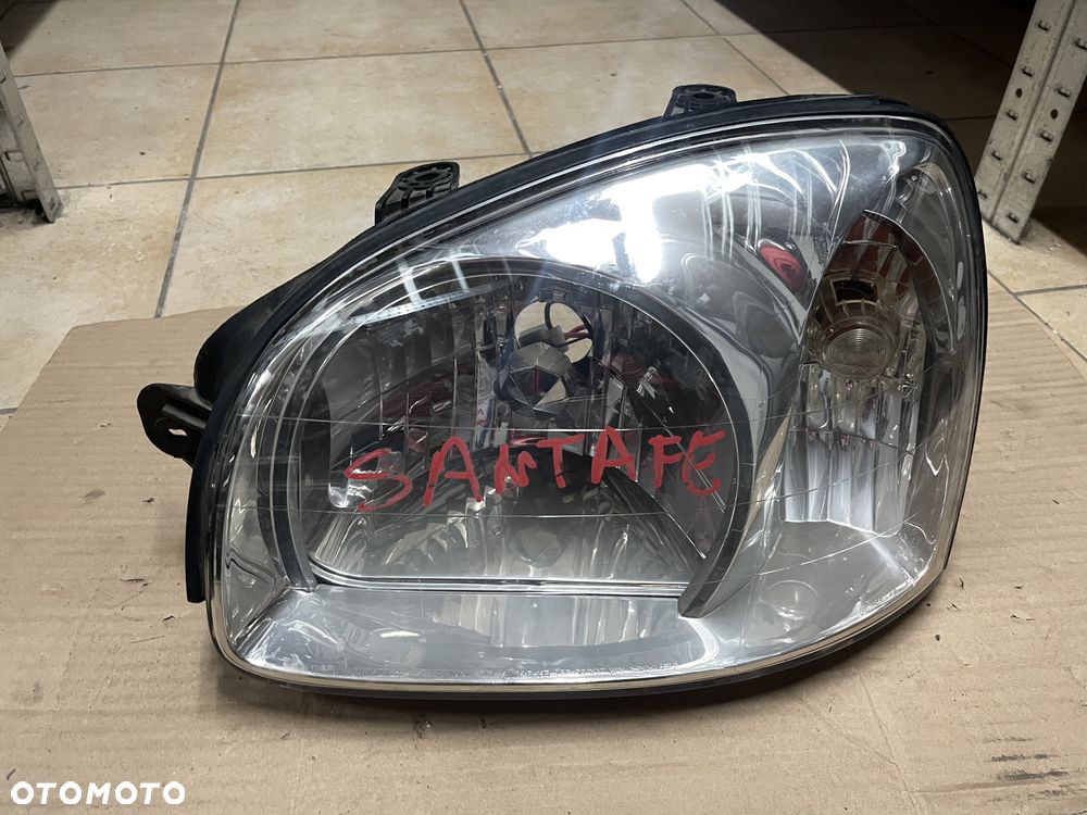 Lampa / reflektor Hyundai Santa Fe I - lewy przód (ORYGINALNE) - 1