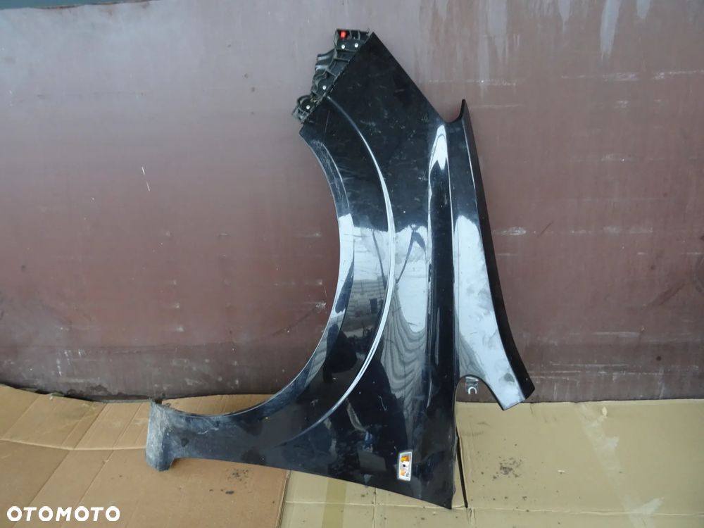 Błotnik Lewy Przód Opel Zafira B Lift Z20R