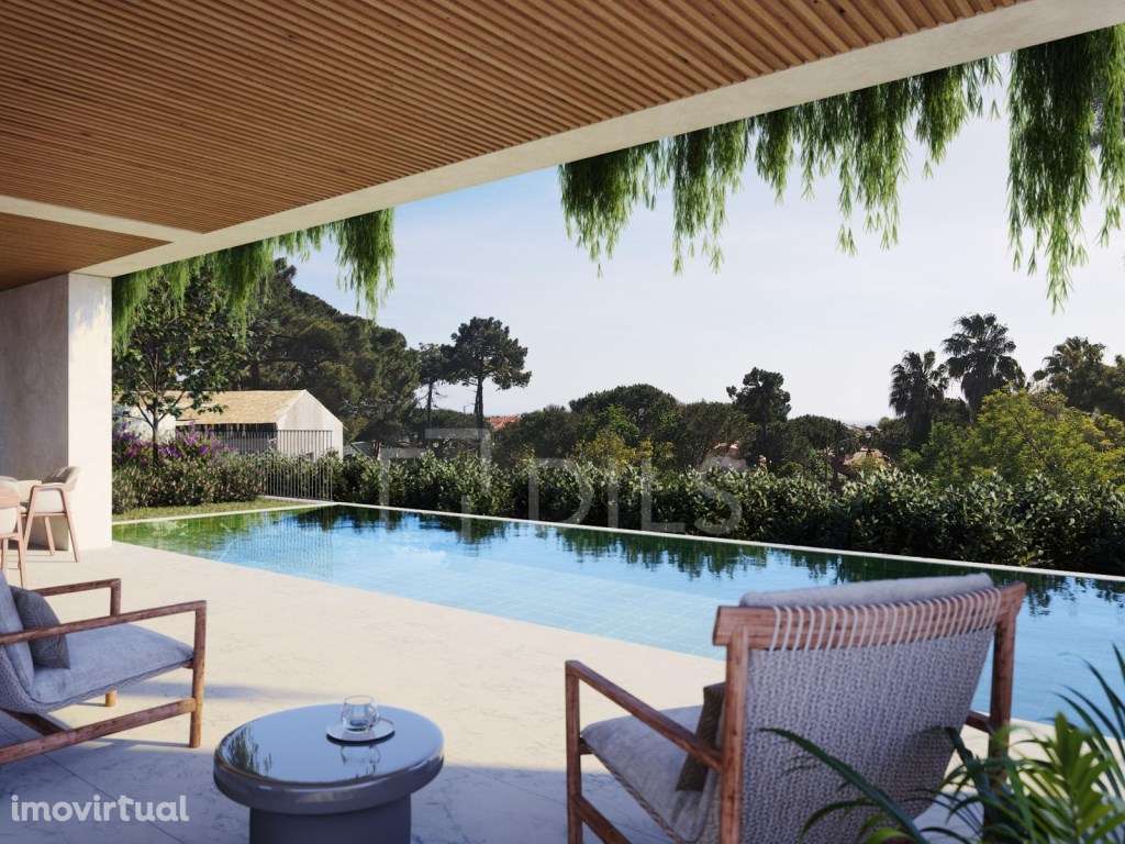 Moradia T4 com jardim, piscina e estacionamento no Estoril - Grande imagem: 3/23