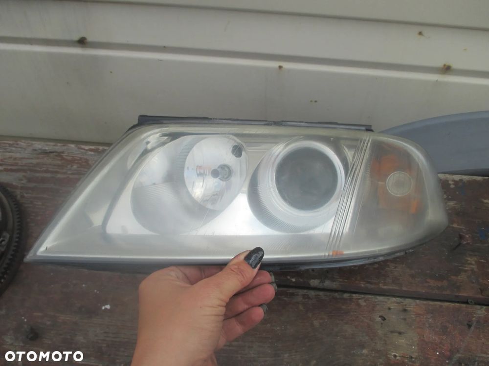 lampa lewa VW Passat B5 LIFT Hella Europa - 2