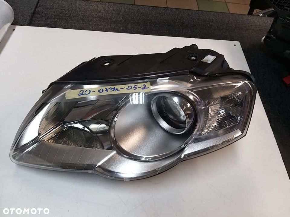 Reflektor  Lewy H7, elektryczny, , kolor wkładu: chromowany VW PASSAT 03.05-11.10  (B693) 01.05 7.10 - 1