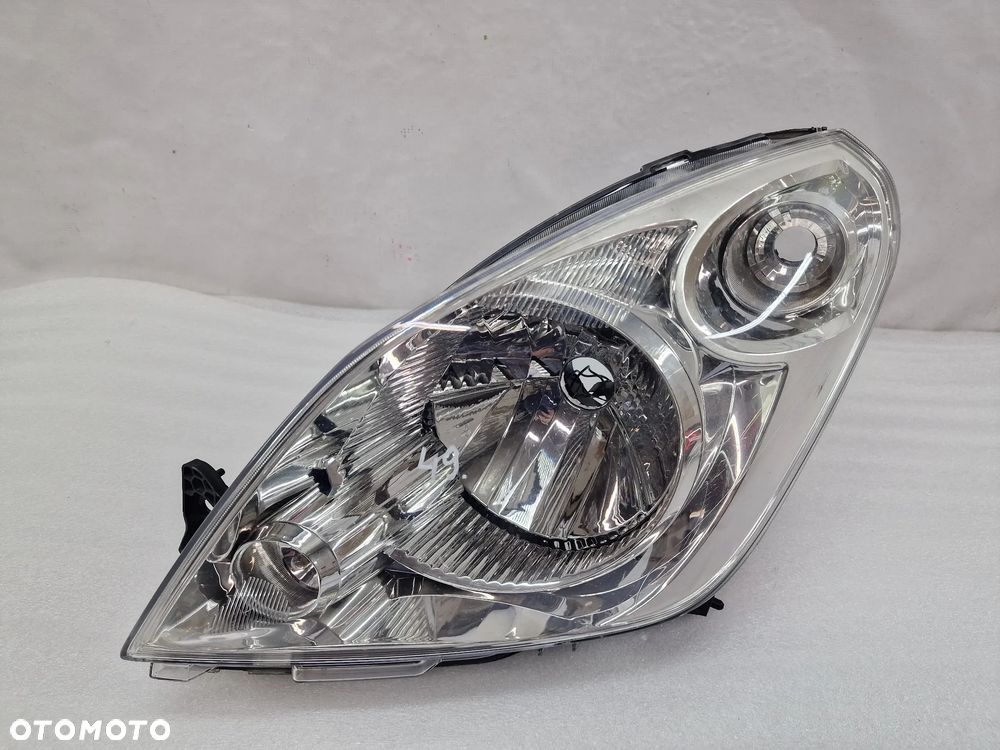 SUZUKI SPLASH LIFT 11- LEWA LAMPA PRZEDNIA PRZÓD , NR 35300-51K20 / 90030690 , NR AUKCJI LPP49 - 1