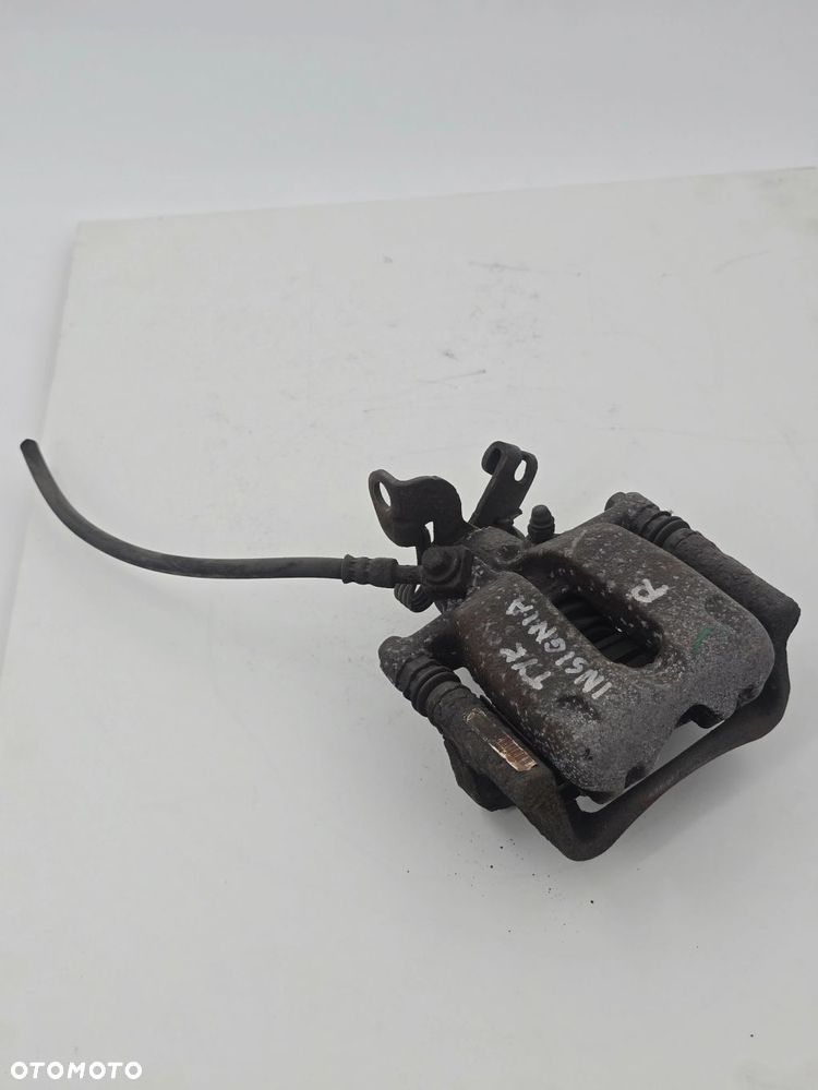 ORYGINALNY ZACISK HAMULCOWY PRAWY TYŁ OPEL INSIGNIA 13390034
