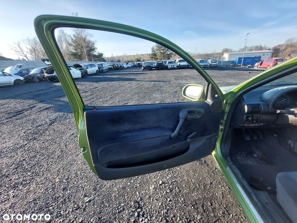 OPEL CORSA B DRZWI LEWY PRZÓD PRZEDNIE LEWE XXCU 52/9 - 2