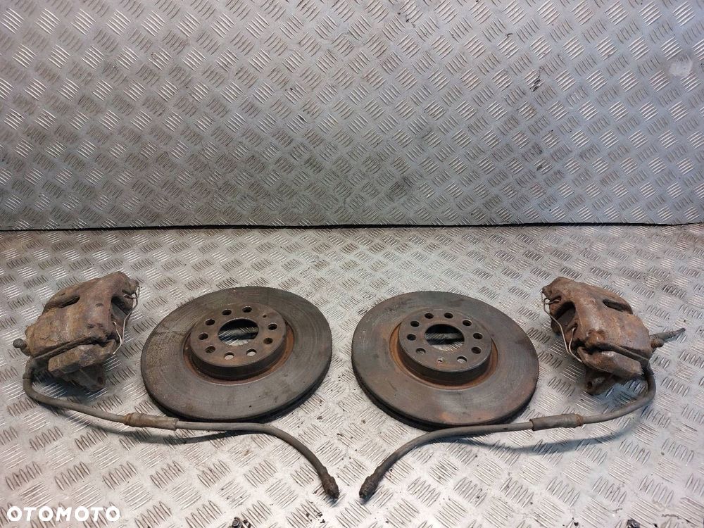 TARCZE HAMULCOWE PRZÓD + KLOCKI + ZACISKI VOLKSWAGEN PASSAT B6 - 1