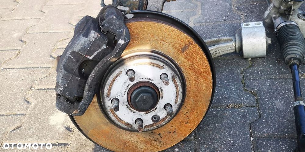 ZACISK WAHACZ LEWY PRZÓD OPEL ASTRA IV J 1.4i TB - 10