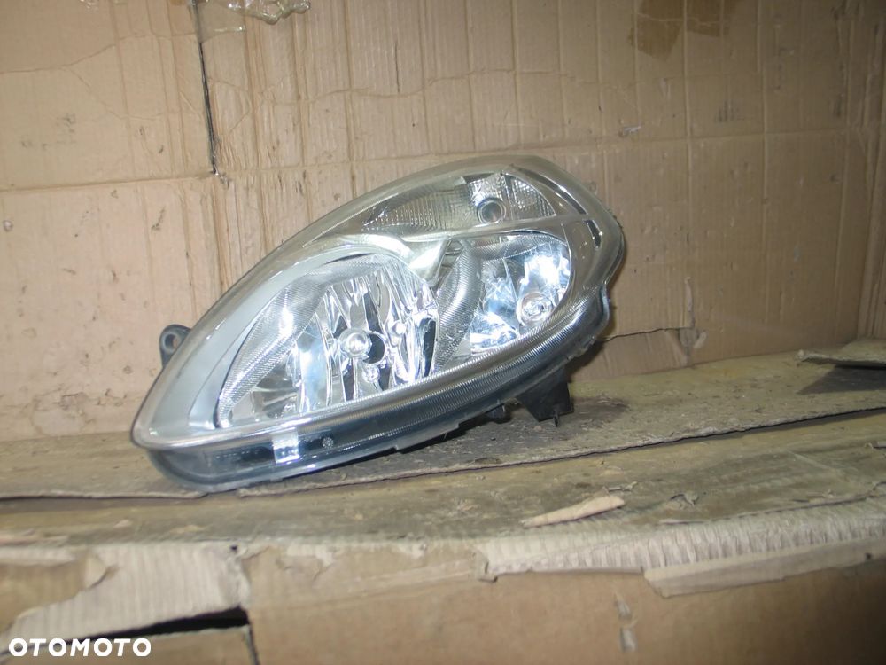 lampa przod lancia ypsilon 2 II lift 06-11r. oryginal europa - 2