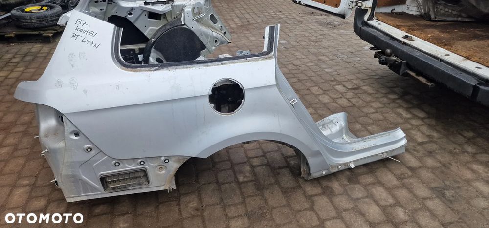 BŁOTNIK Tylny PRAWY VW PASSAT B7 KOMBI