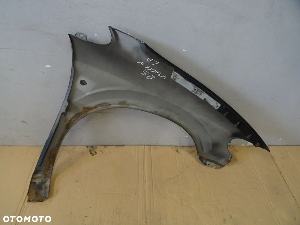 BŁOTNIK LEWY PRZÓD PRZEDNI CHRYSLER VOYAGER IV NR23 - 13