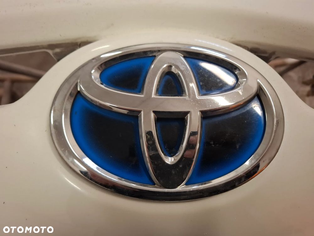 TOYOTA PRIUS III HYBRYDA 09-12r ZNACZEK EMBLEMAT PRZÓD ZDERZAKA - 1