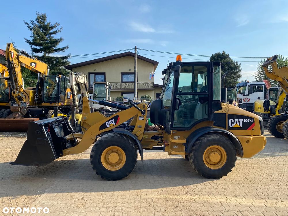 Caterpillar CAT 907H2, 5800 MTH, ŁYŻKA OTWIERANA + WIDŁY, z NIEMIEC, - 1