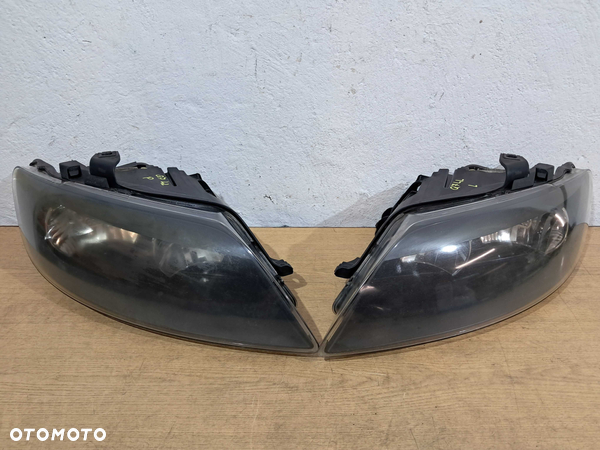 Lampa lampy reflektor reflektory AUDI Q7 4L prawa + lewa przód UK