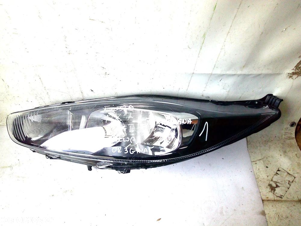 ford fiesta mk7 lampa przód lewa nowa oryg z uszk - 1