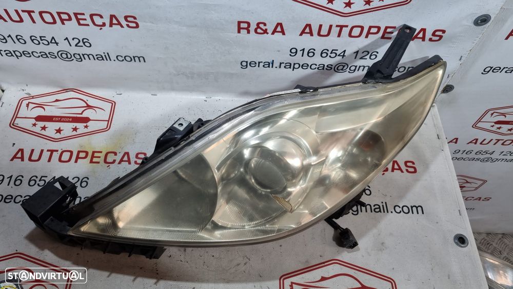 Ótica Farol Frente Frontal Esquerda 5 V Xenón Mazda 2006 149002A011A Original - 2
