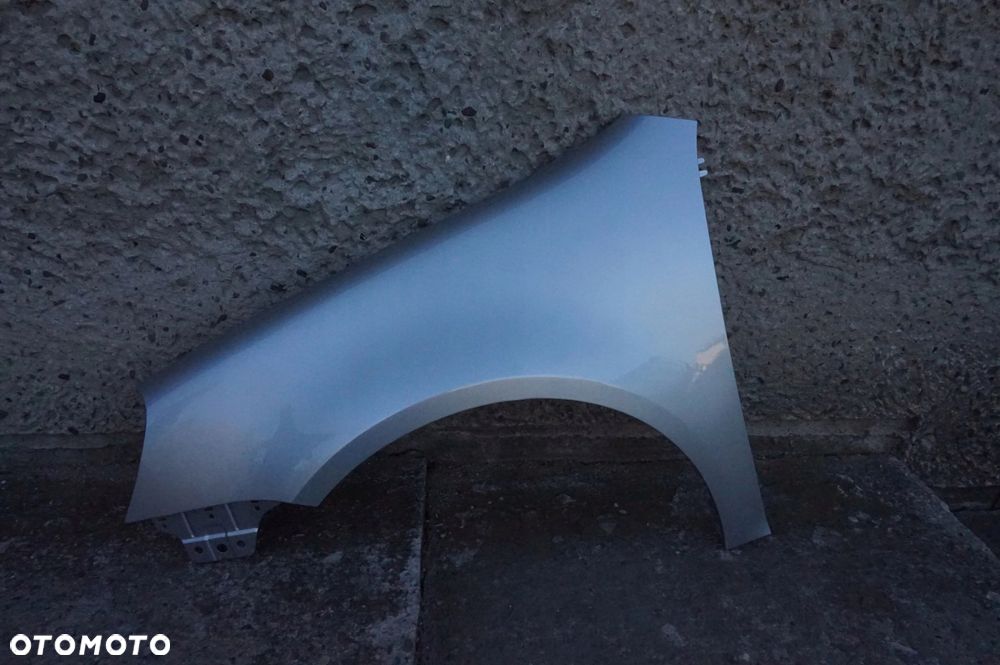 BŁOTNIK PRZEDNI LEWY VW GOLF V 5 LA7W