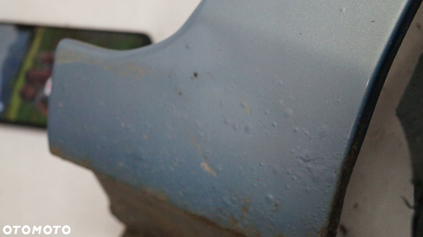 BŁOTNIK PRZEDNI PRAWY FORD FIESTA MK7 79 - 13