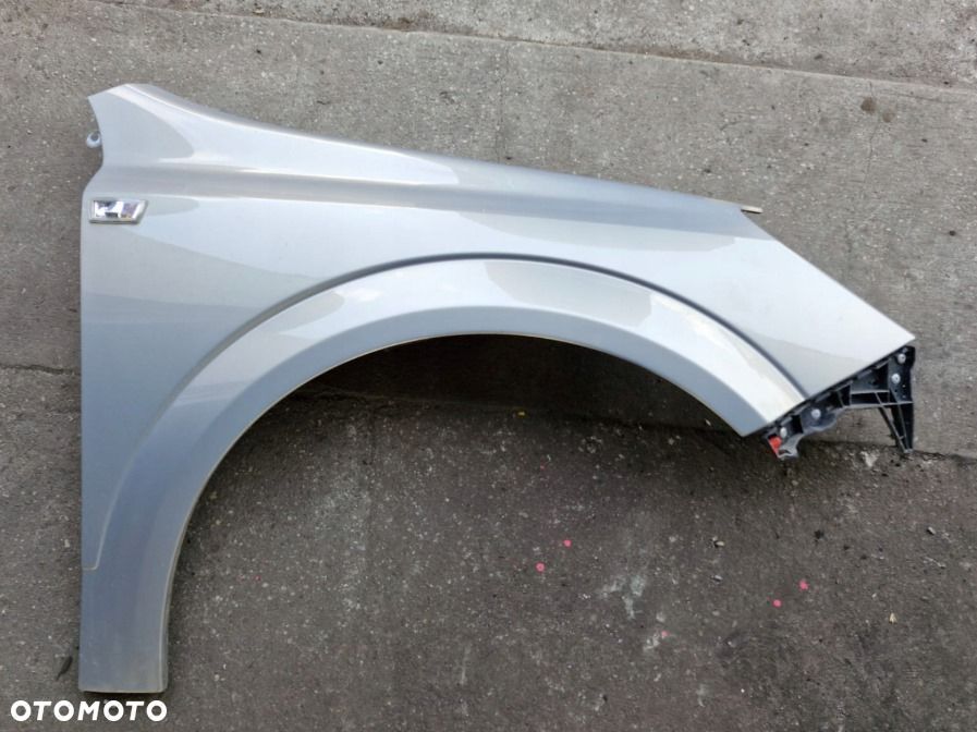 Błotnik prawy przedni przód Opel Astra H III Z167 oryginał
