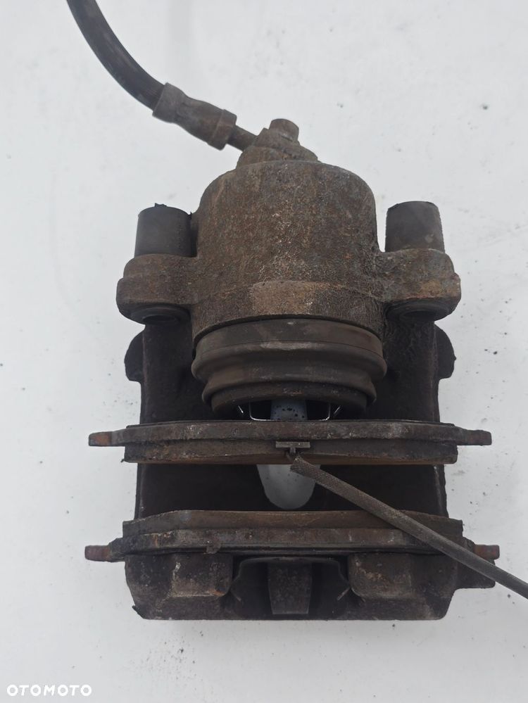 ORYGINALNY ZACISK HAMULCOWY LEWY TYŁ VW GOLF V 1K1 1K0615423 - 4