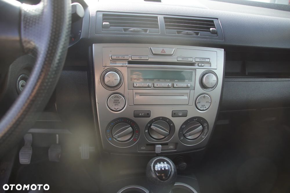 Auto na części - Mazda 2 DY Lift 1.4 CITD 67 KM F6JA 2N1R-7F096-AB 2006R Silnik Skrzynia Drzwi Szyba Lusterko Maska Klapa Lampa Zderzak Deska Kokpit Sterownik Moduł - 12