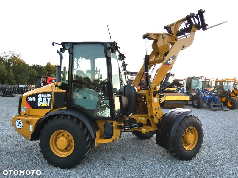 Caterpillar CAT 906H2 Z Niemiec / SZYBKA SKRZYNIA 35KM/H / Super Stan / - 38