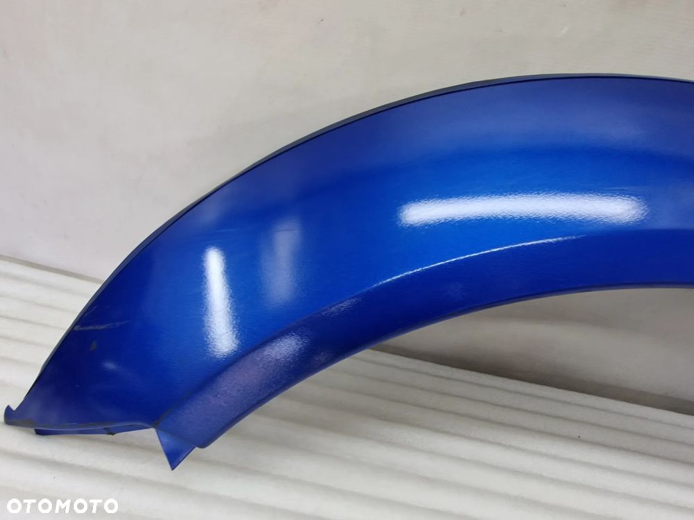 SUZUKI JIMNY 98-12 LEWA PRZEDNIA PRZÓD LISTWA / NAKŁADKA BŁOTNIKA , NR 77630-81A00 / 77630 E81A00-100 , NR AUKCJI NB81 - 4