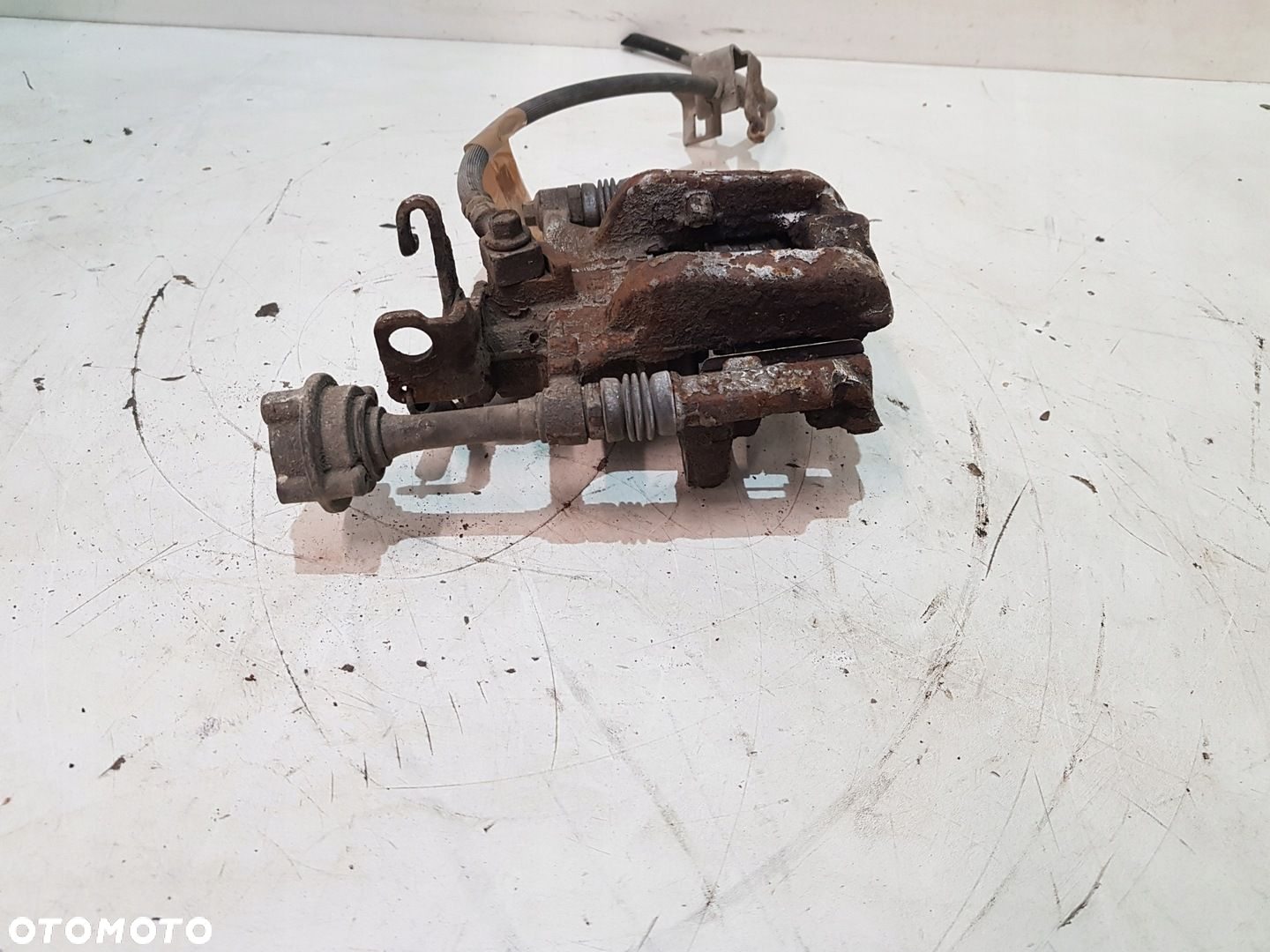 ZACISK HAMULCOWY PRAWY TYŁ OPEL ASTRA J EUR - 8