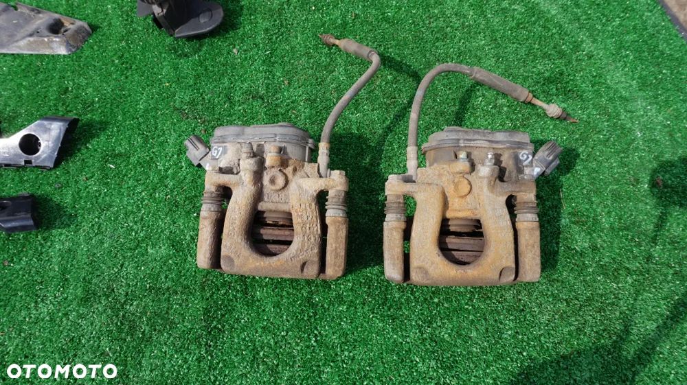 Mazda 6 GJ jarzmo zacisk hamulcowy elektryczny tyl tylny lewy prawy 2015- - 1