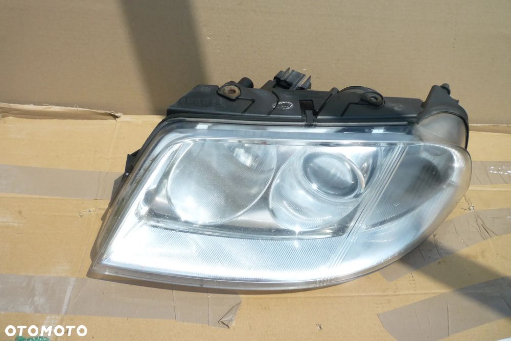 Lampa lewa VW Passat B5 lift Hella Europa - 1
