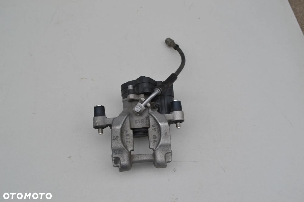 VW PASSAT B8 TIGUAN SKODA SUPERB II KODIAQ  ZACISK HAMULCOWY TYŁ TYLNY LEWY STAN 3Q0615405M