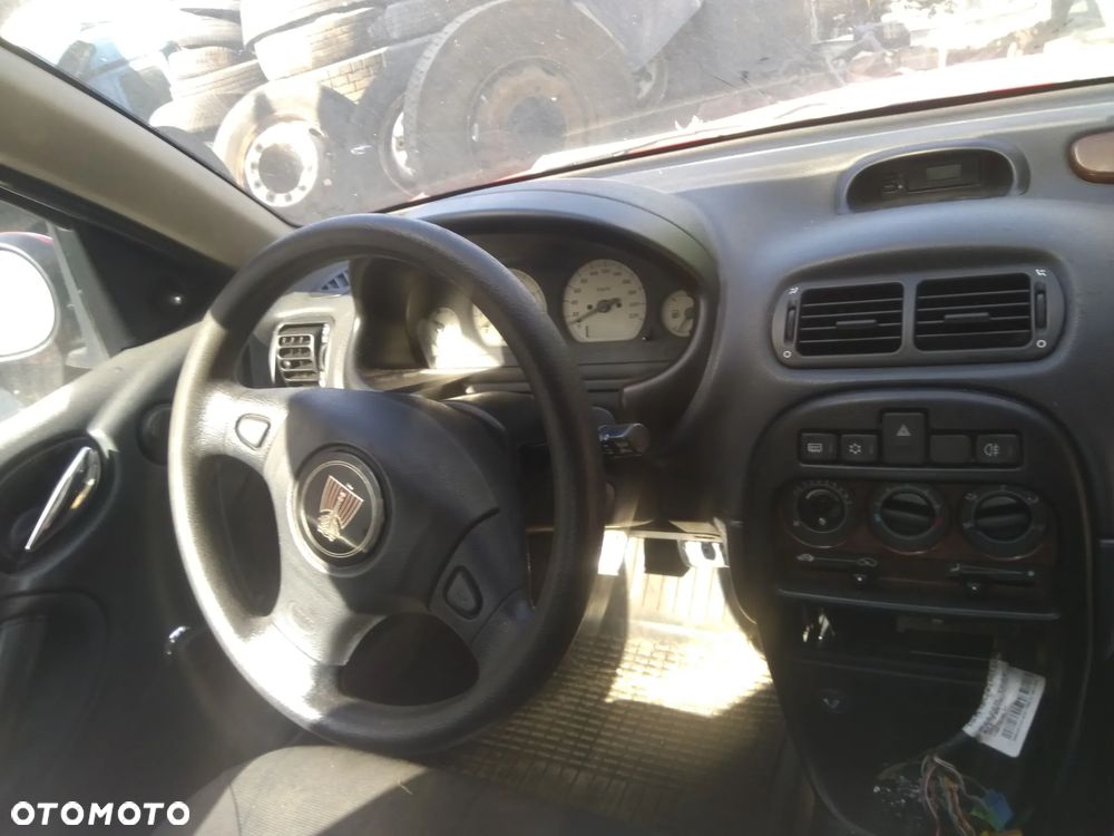 Auto na części - Rover 25 103KM benzyna 2004 Silnik Skrzynia Drzwi Maska Klapa Błotnik Zderzak Lampa Szyba Klamka Lusterko Deska Kokpit - 7