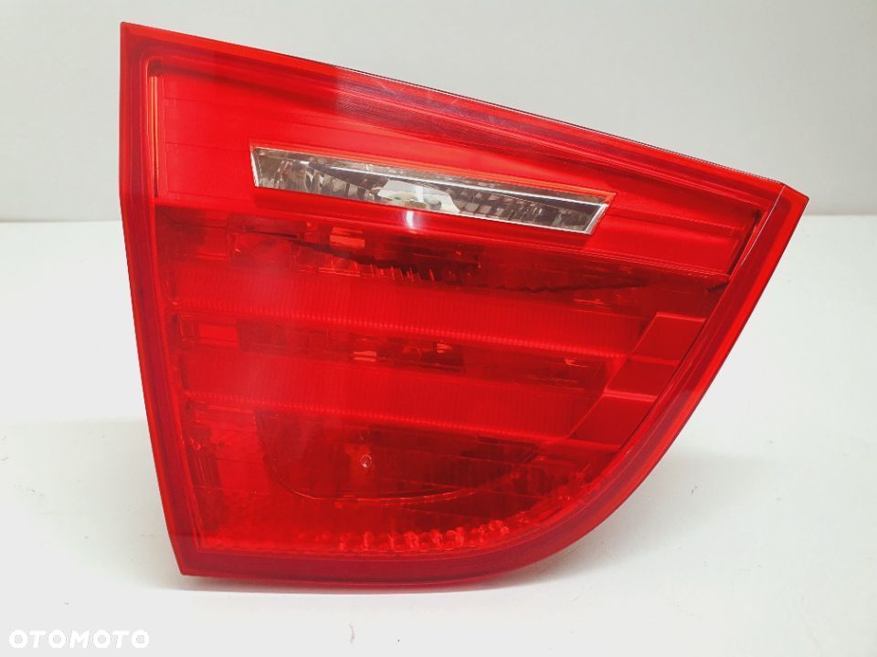 LAMPA TYLNA LEWA W KLAPĘ 7154155 BMW E90 LIFT