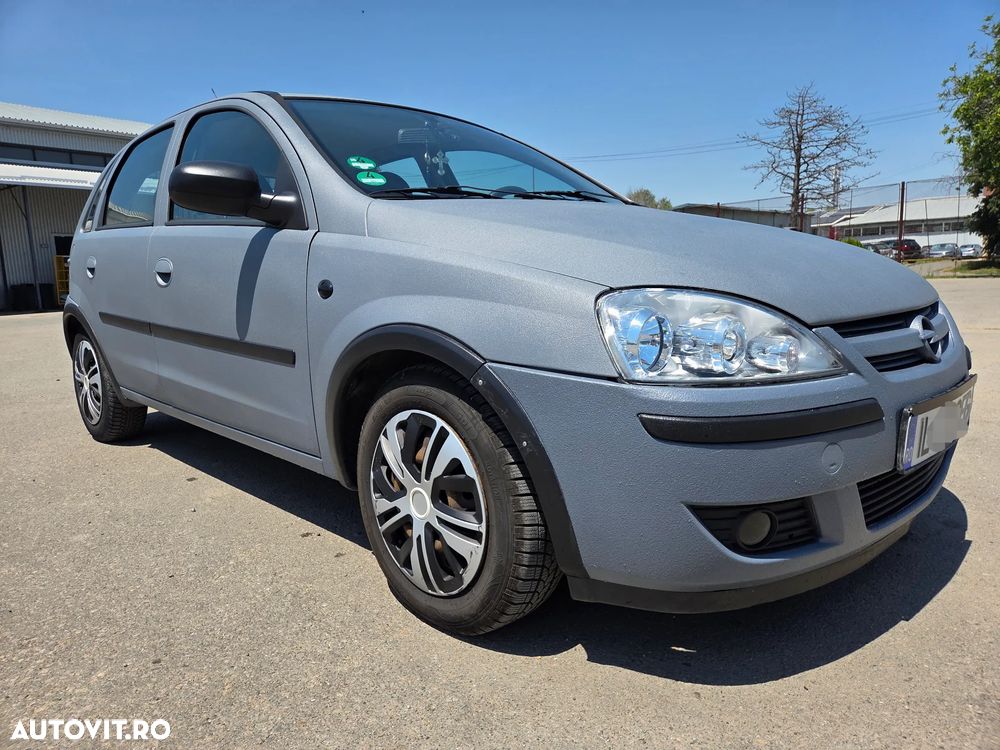 Opel Corsa 1.2i Cosmo - 1