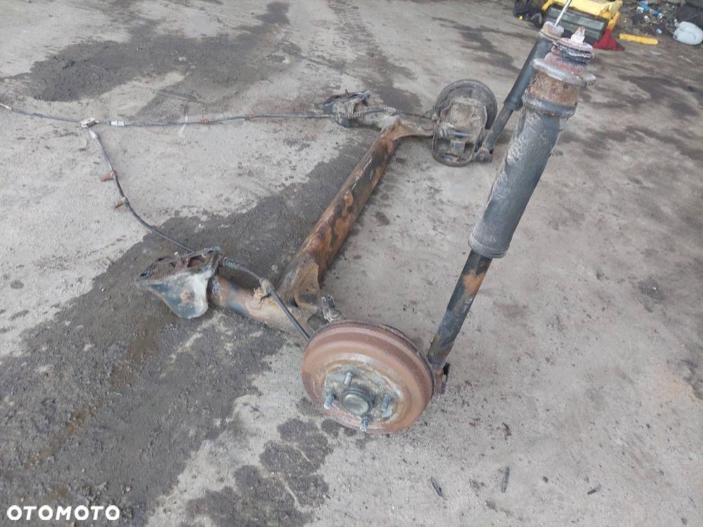 BELKA OŚ ZAWIESZENIA TYŁ BĘBNY BEZ ABS CHEVROLET AVEO I 03-07 HB 5D - 2