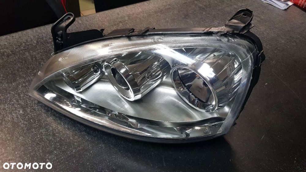 Reflektor Lewy  (H7, elektryczny, bez silnika, soczewka, OPEL COMBO C, CORSA C 06.03-10.10