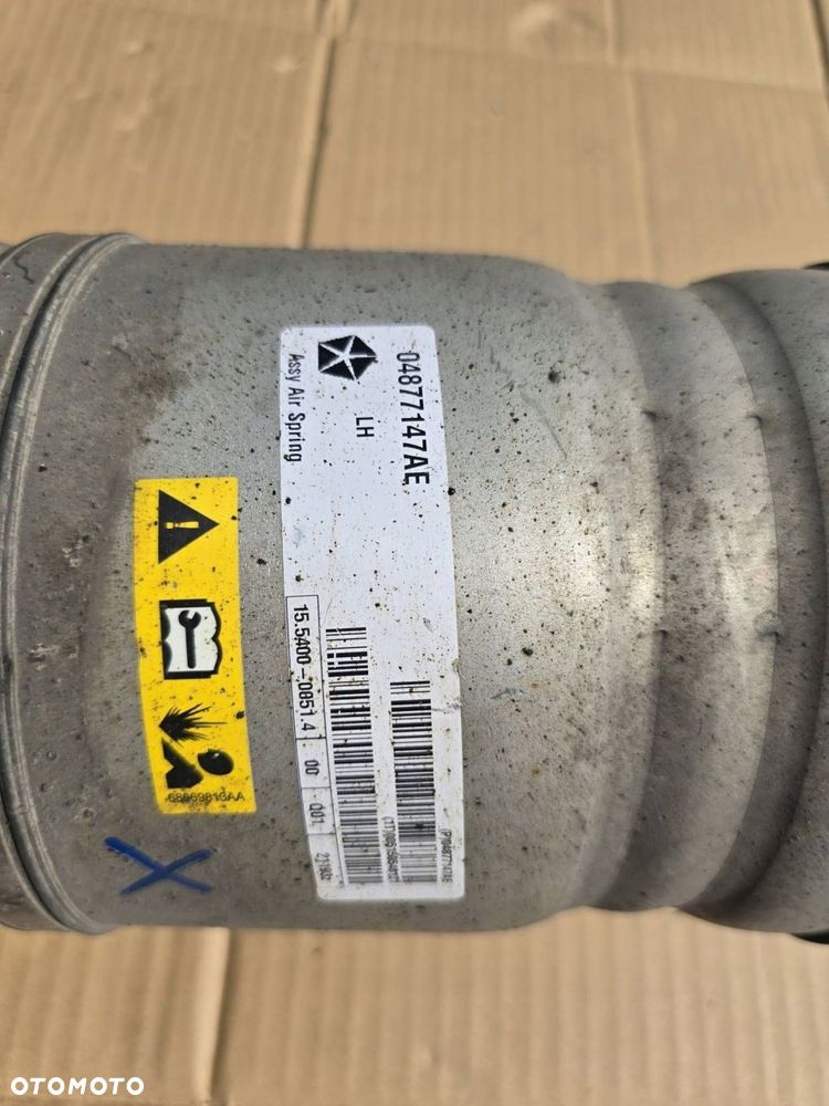 amortyzator lewy 04877147ab dodge ram - 4