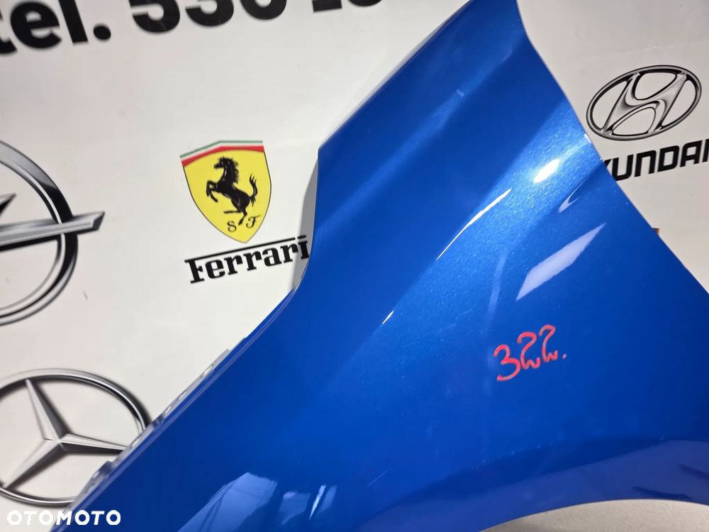 OPEL CORA F 19- LEWY BŁOTNIK PRZEDNI PRZÓD NR AUKCJI BŁ322 - 9
